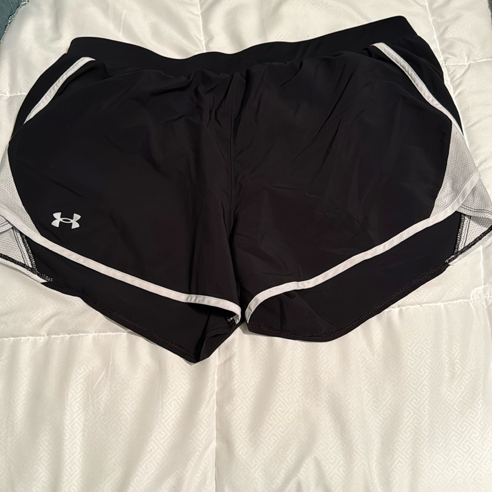 Under Armour black women's running shorts. White stripe on sides